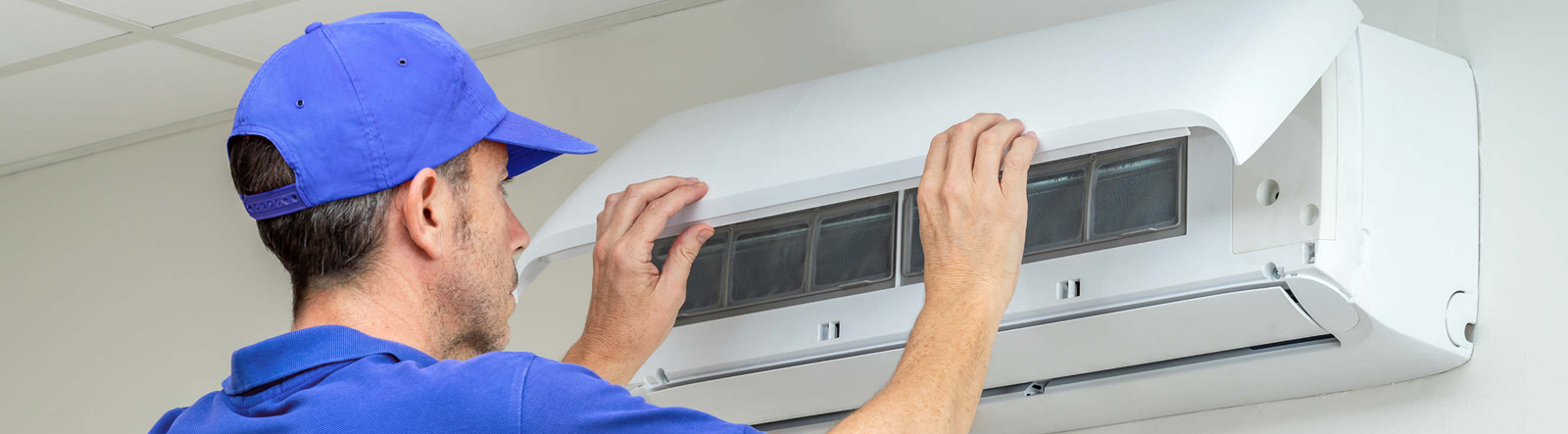 Technician repairing AC