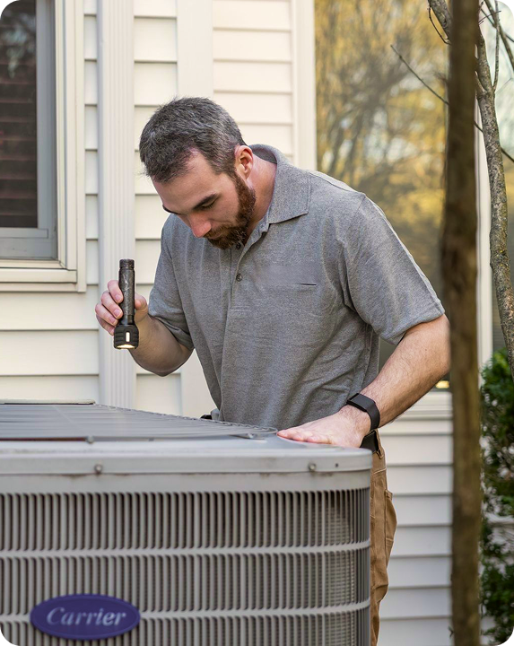 Technician inspecting AC unit